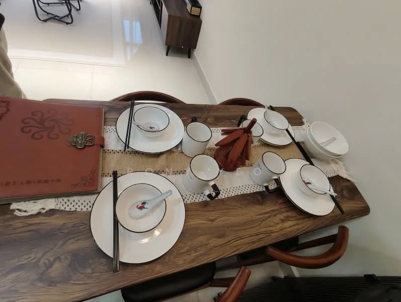 Dining features: wooden dining table, white ceramic plates, black chopsticks, white ceramic bowls, white ceramic cups, decorative table runner, menu book, wooden centerpiece, table setting, modern dining chairs; style: modern.