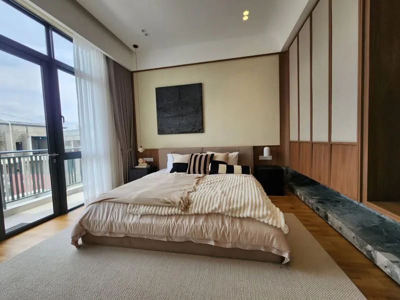 Bedroom features: king-size bed with beige bedding, upholstered headboard, two bedside tables, table lamps on bedside tables, large sliding glass door, floor-to-ceiling windows, wooden flooring, cream painted walls, decorative wall art, textured accent wall, area rug with neutral color, built-in wardrobe, window treatments with sheer curtains; style: modern.