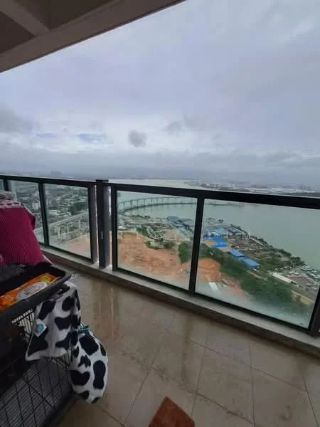 Room features: floor-to-ceiling windows, balcony with glass railing, marble tile flooring, city view, sea view, outdoor space, overhead cover, decorative rug; style: modern; view: city.