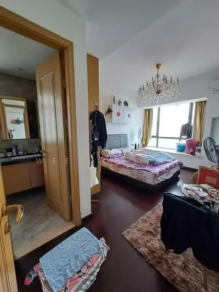 Bedroom features: king-size bed with floral bedding, chandelier light fixture, floor-to-ceiling windows, wooden flooring, decorative wall shelves, wall-mounted mirror, upholstered headboard, area rug with geometric pattern, built-in wardrobe, sliding door to bathroom, decorative plants, bedside table, wall-mounted fan; style: modern; view: city. Bathroom features: vanity with sink, mirror above vanity, tile flooring, shower area, toilet, towel rack.