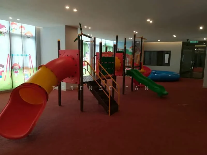 Room features: indoor playground equipment, red slide, green climbing structure, yellow stairs, blue inflatable area, colorful wall graphics, carpet flooring in red, overhead recessed lighting; style: modern.
