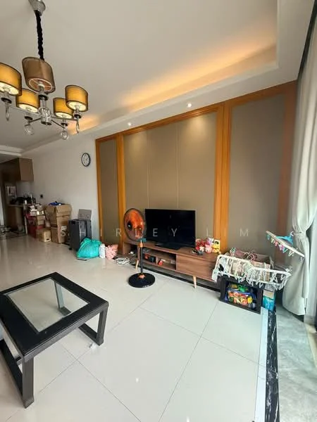 Living features: white walls, tray ceiling with recessed lighting, large window with sheer curtains, floor-to-ceiling glass door, polished tile flooring, wooden feature wall, TV console, wall-mounted TV, coffee table, ceiling fan, decorative wall clock, various boxes and items in the background; style: modern.