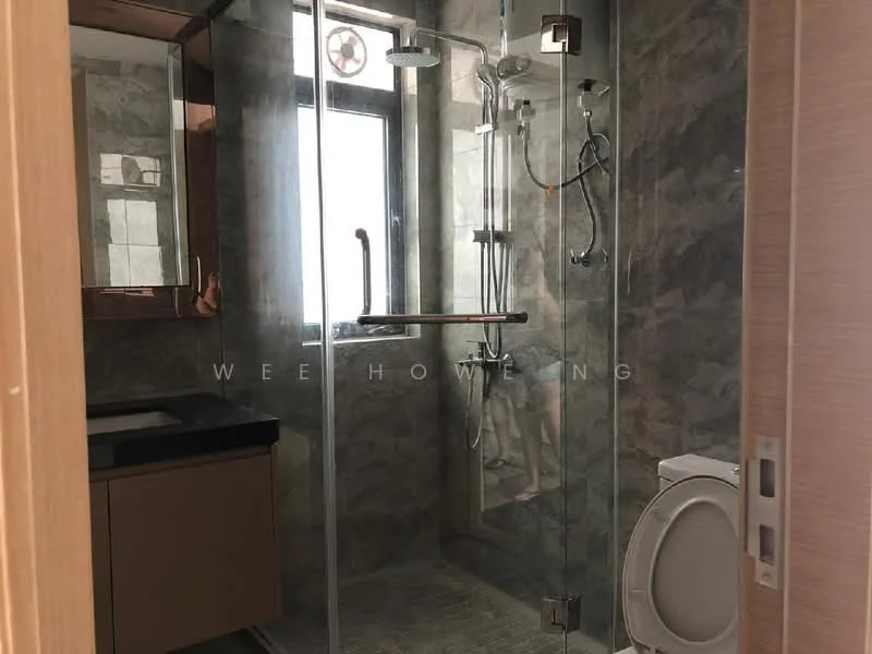 Bathroom features: glass shower enclosure, rain shower head, handheld shower, chrome wall-mounted faucet, single-sink vanity with dark countertop, mirror above vanity, toilet, grey tile flooring, marble wall cladding, window for natural light; style: modern.