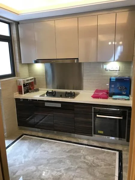 Kitchen features: brown and cream cabinetry, white countertop, stainless-steel backsplash, built-in oven, 4-burner gas hob, stainless-steel range hood, dishwasher, marble tile flooring, single-bowl stainless-steel sink, window with black frame, recessed lighting, kitchen appliances in red and blue; style: modern.