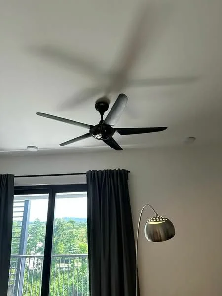 Room features: 5-blade ceiling fan with light, floor-to-ceiling windows, blackout curtains, lamp with metallic finish, white painted walls, recessed lighting; style: modern; view: garden.