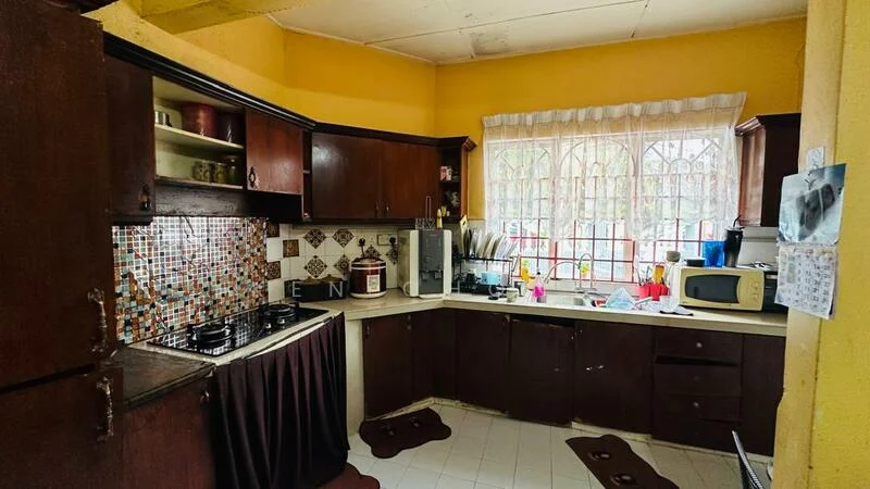 Kitchen features: brown wooden cabinetry, white countertop, gas stove with 4 burners, built-in oven, microwave, kitchen sink, colorful mosaic tile backsplash, window with grid pattern, tile flooring, kitchen towels, kitchen utensils, decorative items on countertop, 2 brown mats on floor; style: traditional.
