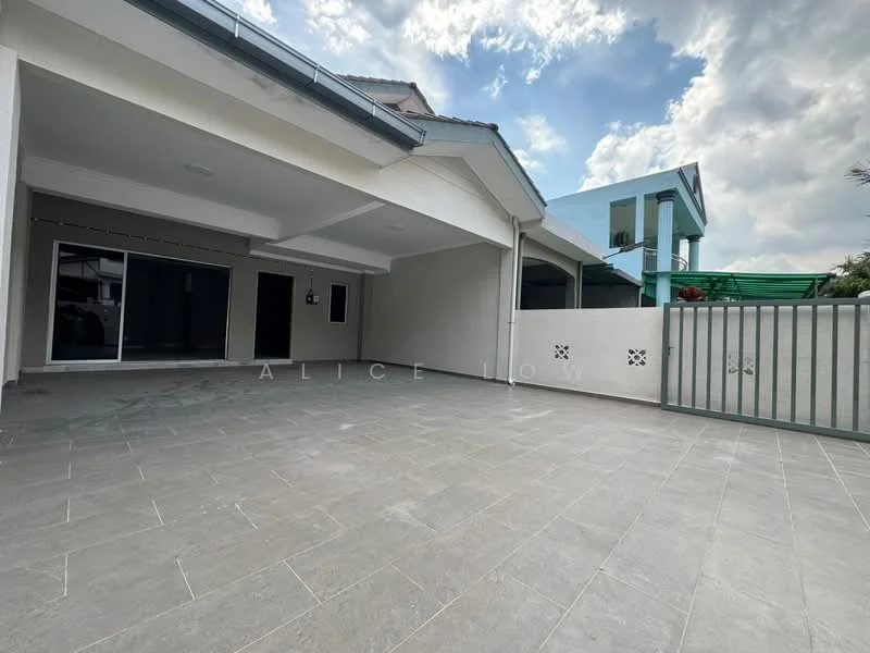 Exterior features: grey tiled flooring, covered porch area, white painted walls, sliding glass doors, fenced perimeter, greenery visible in background, partially shaded area, open space for parking; style: modern.
