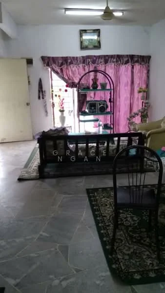 Living features: marble tile flooring, white painted walls, pink curtains, wooden coffee table, green upholstered sofa, decorative wall shelf, framed artwork on wall, area rug with floral pattern, black dining chair; style: traditional.