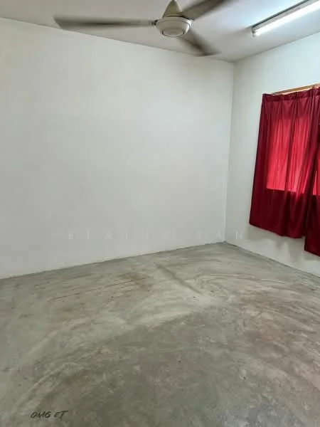 Room features: white painted walls, concrete flooring, ceiling fan, red curtains, single window.