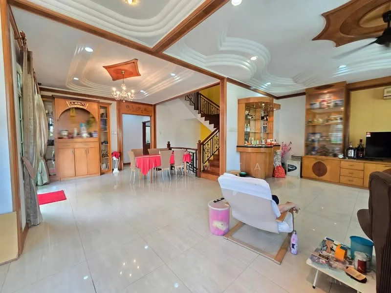 Living features: cream painted walls, white ceiling with decorative moulding, marble tile flooring, 5-blade ceiling fan with light, wall-mounted TV, wooden shelving unit, decorative display cabinet, large windows with sheer curtains, area rug, chandelier, open layout to dining area, staircase with wooden railing; style: modern. Dining features: 6-seater dining table, red tablecloth, upholstered dining chairs, wooden cabinetry, decorative wall art; style: modern.