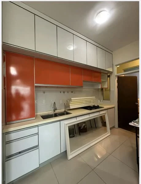 Kitchen features: white cabinetry with orange accents, double-bowl stainless-steel sink, chrome pull-down faucet, built-in gas hob, white countertop, ceramic tile flooring, recessed ceiling lights, wall-mounted cabinets, open shelving, kitchen island with frame, door leading to hallway; style: modern.