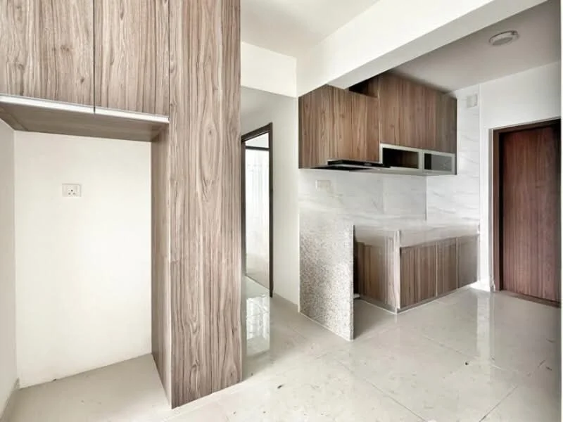 Kitchen features: wood cabinetry, white marble countertop, stainless-steel sink, built-in kitchen cabinet, open layout, ceramic tile flooring, wall-mounted range hood, neutral wall colour; style: modern. Room features: white painted walls, doorway leading to another room, light fixture.