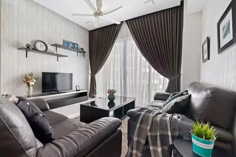 Living features: dark leather sofa, 3-seater sofa, coffee table, TV console, wall-mounted TV, decorative wall shelves, floor-to-ceiling windows, sheer curtains, blackout curtains, area rug, ceiling fan with light, decorative plants, framed artwork; style: modern.