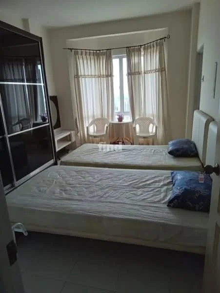 Bedroom features: two single beds with mattresses, upholstered headboards, floor-to-ceiling windows, sheer curtains, built-in wardrobe with sliding doors, study desk, two chairs, tile flooring, neutral wall color, decorative plant on window sill; style: modern.