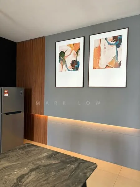 Kitchen features: stainless-steel fridge, marble countertop, wood paneling, grey painted wall, two framed artworks, recessed lighting, cream tile flooring; style: modern.