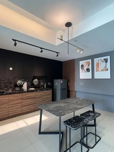 Kitchen features: black marble countertop, wood cabinetry, stainless-steel fridge, built-in oven, 4-burner gas hob, black pendant light, track lighting, grey walls, white ceiling, dining table with grey top, black metal stools, framed artwork on walls; style: modern.