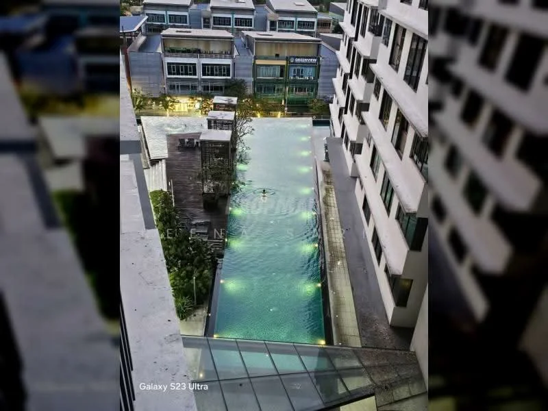 Exterior type: high-rise condominium; features: infinity pool, pool deck with loungers, landscaped garden area, surrounding commercial buildings, modern architectural design, glass railing, outdoor lighting, water features; style: modern.