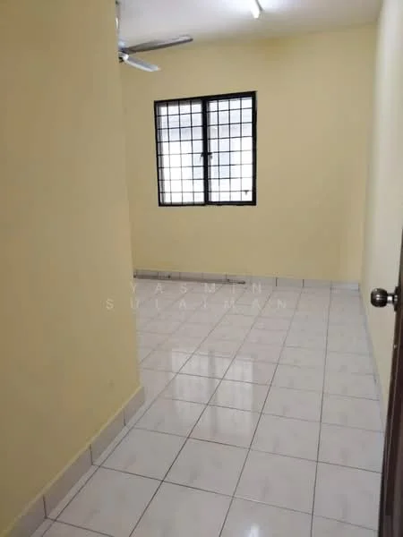 Room features: yellow painted walls, white tiled flooring, ceiling light, 1 ceiling fan, square window with black metal grille, no visible furniture.
