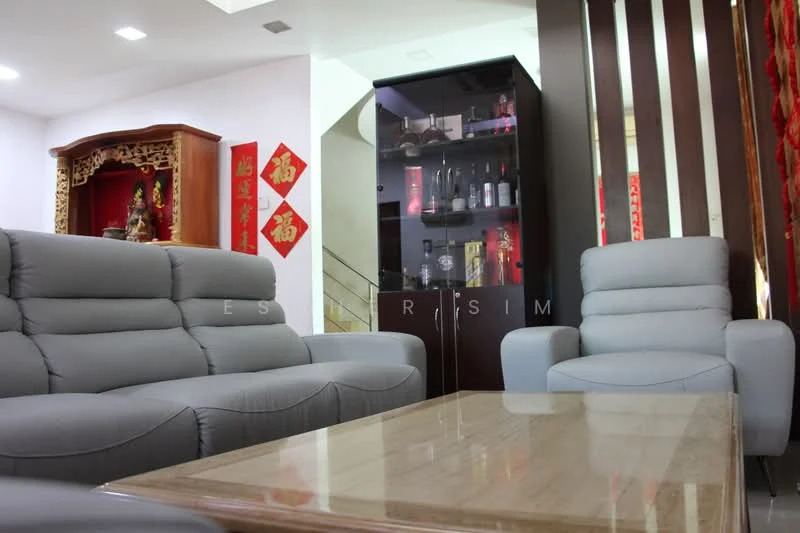 Living features: 3-seater fabric sofa in grey, 2-seater fabric armchair in grey, marble coffee table, wooden display cabinet with glass doors, decorative wall with vertical wooden slats, red decorative wall hangings, recessed ceiling lights, staircase in background; style: modern.