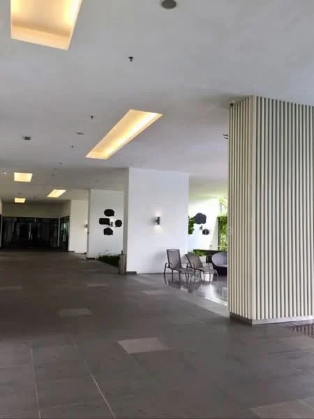 Exterior type: clubhouse; features: white painted walls, strip lighting on ceiling, grey tiled flooring, decorative wall panels, outdoor seating area with chairs, landscaped greenery, modern wall sconces; style: modern.