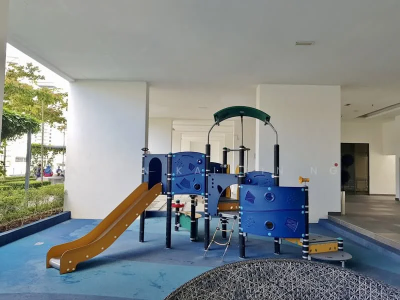Exterior type: children's playground; features: play structure with slide, climbing frame, colorful play panels, rubber flooring, surrounding greenery, paved walkway, covered area, safety barriers; style: modern.