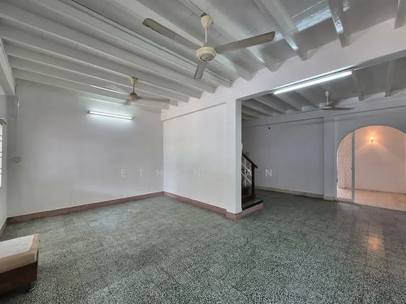 Room features: exposed beams ceiling, white painted walls, green terrazzo flooring, 2 ceiling fans, arched doorway, staircase visible, wall-mounted light fixture, natural light from windows; style: traditional.