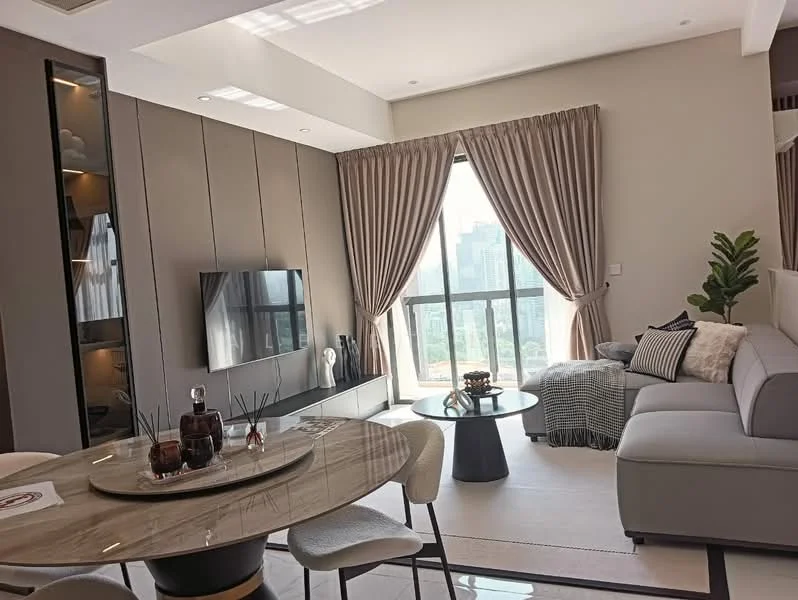 Living features: grey fabric sectional sofa, round coffee table, wall-mounted TV, floor-to-ceiling windows, sheer curtains, blackout curtains, decorative plant, area rug, light-colored walls, recessed downlights, decorative throw pillows, accent wall with shelving; style: modern; view: city.