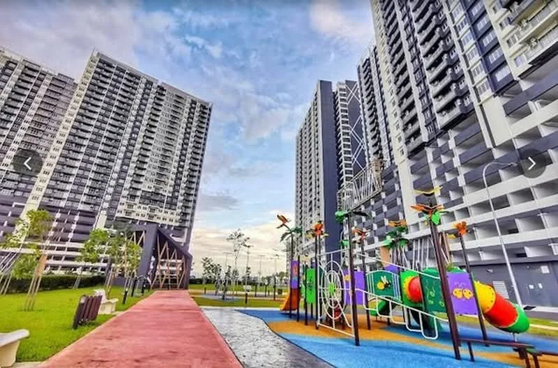 Exterior type: high-rise condominium; features: playground with climbing structures, manicured lawn, paved walking path, surrounding high-rise buildings, landscaped garden area, outdoor seating benches, colorful play equipment, open green space; style: modern.