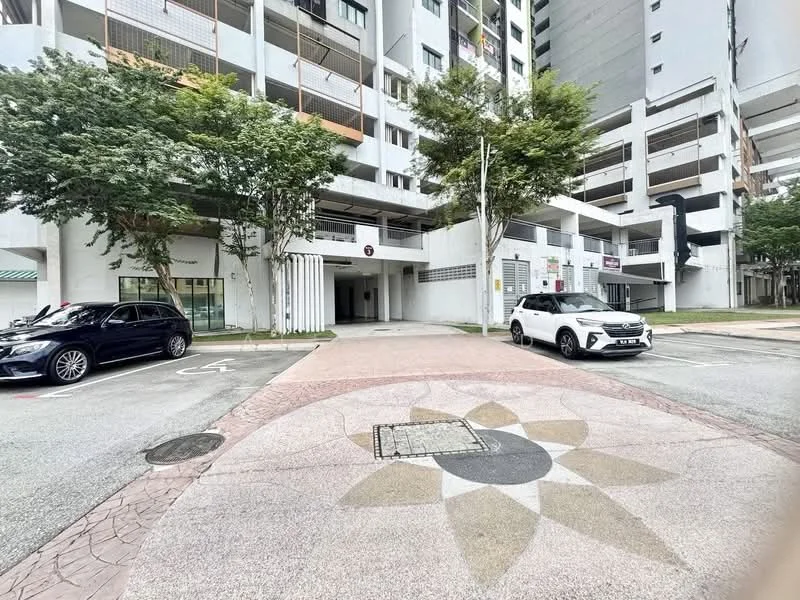 Exterior type: mid-rise condominium; features: manicured landscaping, paved walkway with decorative pattern, covered parking area, multiple storeys visible, trees lining the entrance, vehicle parking spaces, entrance to building, security access point; style: modern.