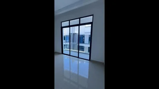Room features: white painted walls, glossy tile flooring, floor-to-ceiling windows, sliding glass door, natural light from windows.