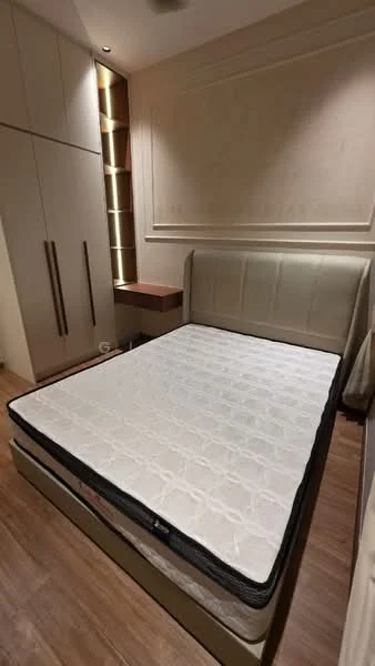 Bedroom features: queen-size bed, upholstered headboard, wooden flooring, built-in wardrobe with sliding doors, nightstand with drawer, recessed lighting, decorative wall paneling, neutral wall color; style: modern.