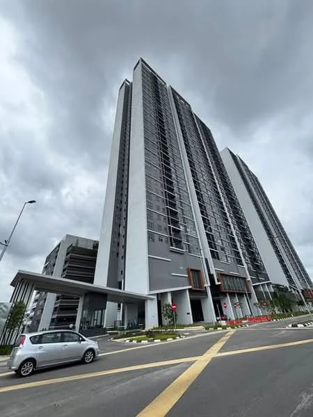 Exterior type: high-rise condominium; features: glass curtain wall, grey painted facade, recessed balconies, multiple storeys, covered entrance, landscaped surroundings, parking structure visible, urban context with road access; style: modern.