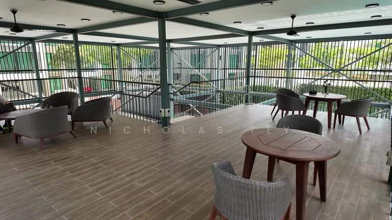 Exterior type: clubhouse; features: open-air seating area, metal railing, wooden flooring, ceiling fans, outdoor tables, woven chairs, greenery visible below, covered roof, modern design, spacious layout; style: modern.