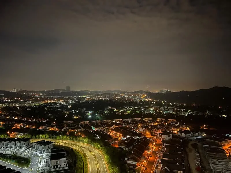 Exterior features: night view of city skyline, hills in background, suburban residential area, curved road, street lights visible, scattered buildings, dark sky with clouds.