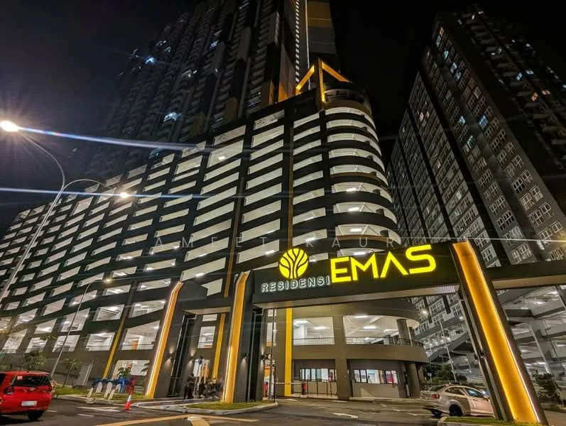 Exterior type: high-rise condominium; features: glass curtain wall, illuminated signage, multi-storey car park, modern architectural design, covered entrance, landscaped surroundings, street lighting, parking access, balconies on upper floors, security features visible; style: modern.