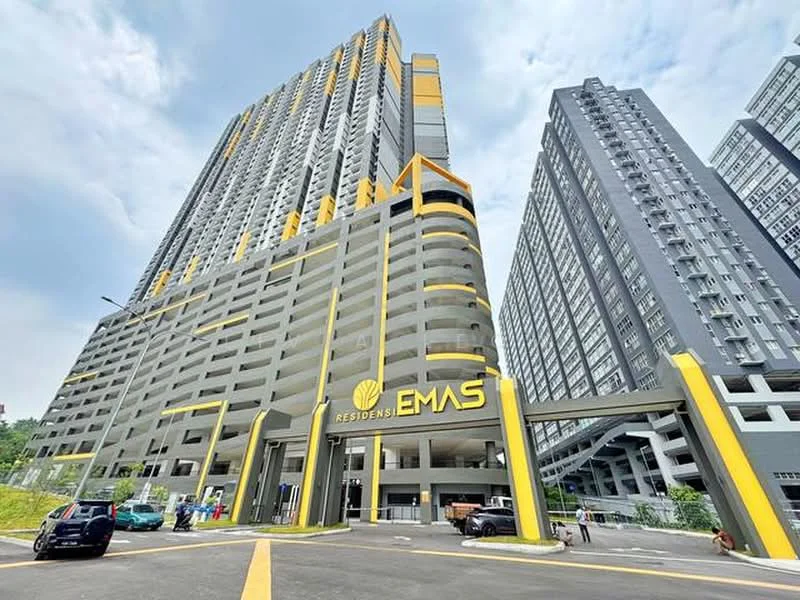 Exterior type: high-rise condominium; features: yellow and grey painted facade, glass curtain wall, recessed balconies, multiple storeys, covered parking area, main entrance with signage, landscaped surroundings, driveway with interlocking pavers; style: modern.