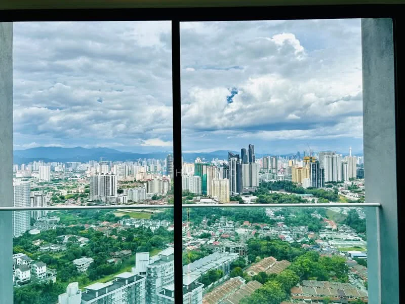 Exterior type: high-rise condominium; features: floor-to-ceiling windows, glass balcony railing, city skyline view, surrounded by greenery, urban landscape, distant mountains, cloudy sky; style: modern.