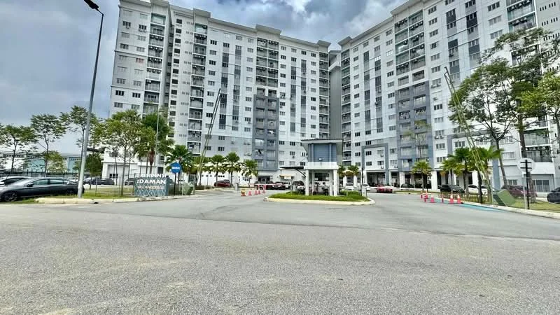 Exterior type: high-rise condominium; features: white painted facade, glass curtain wall, recessed balconies, landscaped entrance, manicured lawn, palm trees, parking area, security guard house, multiple storeys, signage at entrance; style: modern.