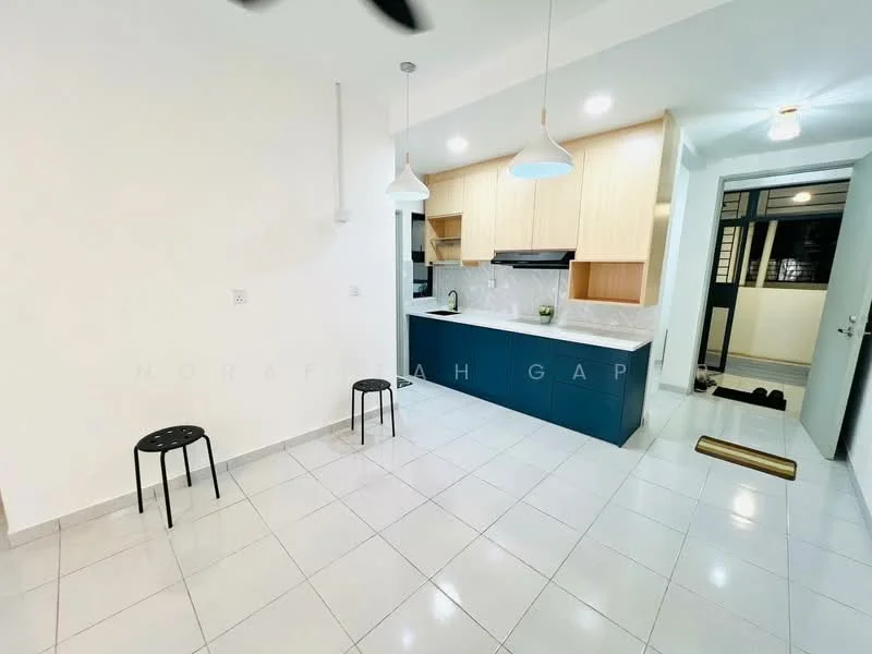 Kitchen features: white painted walls, light grey floor tiles, kitchen island with blue cabinetry, light wood upper cabinets, white marble countertop, single-bowl stainless-steel sink, chrome pull-down faucet, two pendant lights, recessed downlights, open layout, two black stools; style: modern.