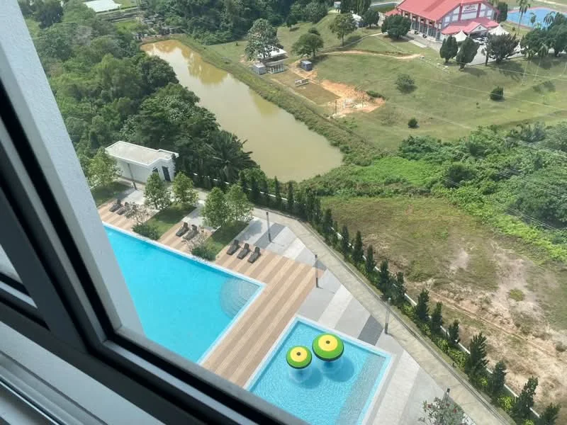 Exterior type: high-rise condominium; features: infinity pool, pool deck with loungers, manicured landscaping, surrounding greenery, view of a river, view of open fields, children's playground, outdoor dining area; style: modern.