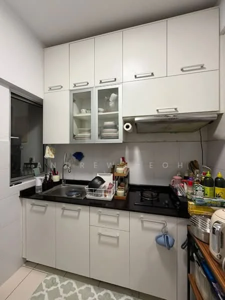 Kitchen features: white cabinetry with glass-front upper cabinets, black granite countertop, single-bowl stainless-steel sink, chrome pull-down faucet, built-in gas hob, exhaust hood, dish rack, kitchen utensils, various condiments and cooking oils, tile backsplash, light grey tiled flooring, window with sheer curtains; style: modern.