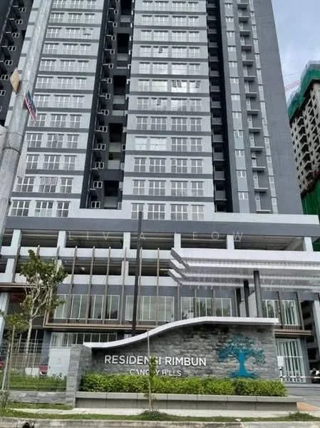 Exterior type: high-rise condominium; features: glass curtain wall, grey painted facade, recessed balconies, feature lighting at night, manicured landscaping, signage at entrance, multiple storeys, surrounded by mature greenery; style: modern.