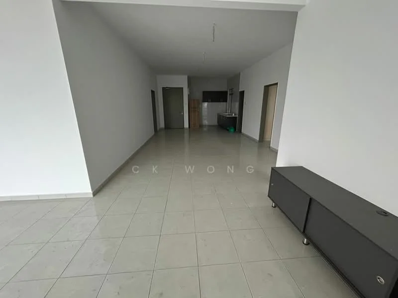 Room features: white painted walls, grey tiled flooring, open layout, large windows, kitchen area visible in background, no visible furniture, high ceiling, neutral color scheme; style: modern.