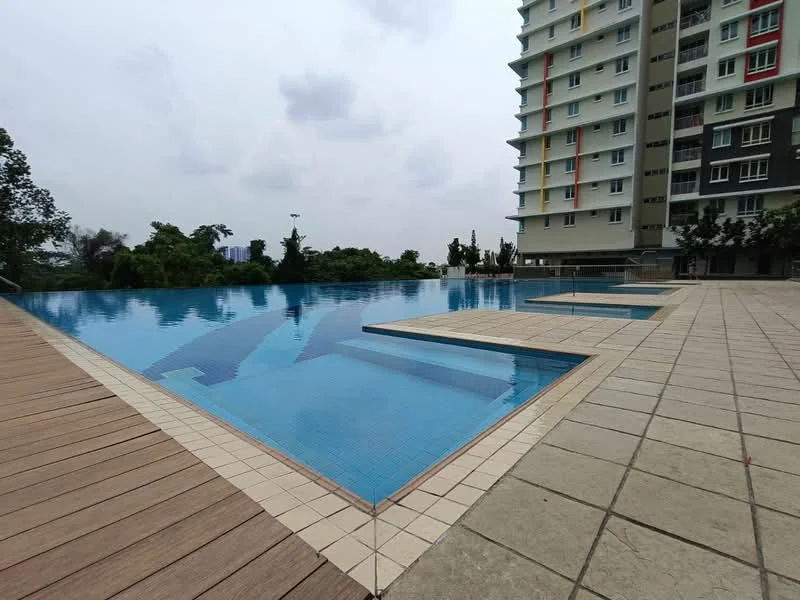 Exterior type: high-rise condominium; features: infinity pool, pool deck with loungers, surrounded by greenery, tiled pool area, wooden decking, landscaped garden, multi-storey building, balconies on upper floors; style: modern.