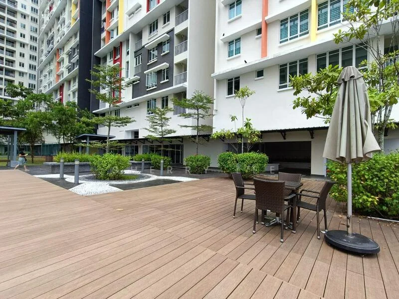 Exterior type: mid-rise condominium; features: wooden deck flooring, outdoor dining set with chairs, umbrella for shade, landscaped greenery with shrubs, water feature with stones, surrounding residential buildings, manicured lawn; style: modern.