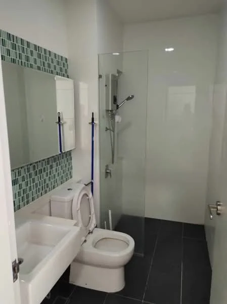 Bathroom features: glass shower enclosure, rain shower head, handheld shower, white ceramic toilet, single-sink vanity with cabinet, mirror above sink, green mosaic tile backsplash, dark tile flooring, recessed lighting; style: modern.