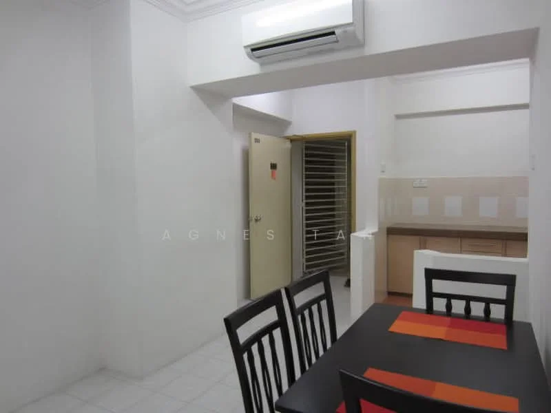 Dining features: black dining table with orange placemats, 4 black wooden dining chairs, white painted walls, white tiled flooring, wall-mounted split AC, door leading to another room, kitchen countertop visible in background, light fixture on ceiling. Room features: white painted walls, white tiled flooring, door leading to another room, kitchen countertop visible in background.