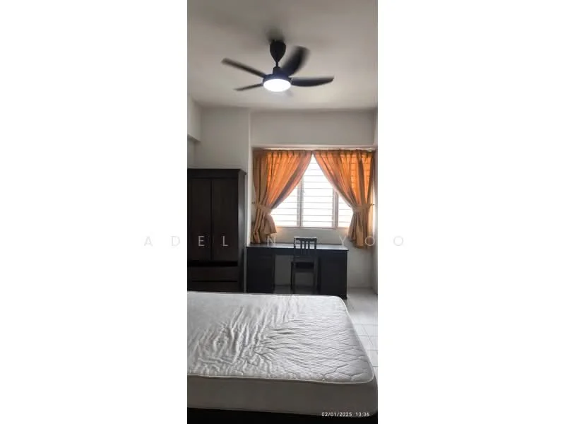 Bedroom features: queen-size bed, 5-blade ceiling fan with light, wooden wardrobe, study desk, window with sheer curtains, orange curtains, white walls, tile flooring.