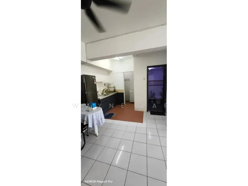 Kitchen features: white walls, grey tiled flooring, ceiling fan, black cabinetry, stainless-steel fridge, built-in countertop, sink, kitchen island, wall-mounted shelves, window for natural light, light fixture, open layout, dining table, stool; style: modern.
