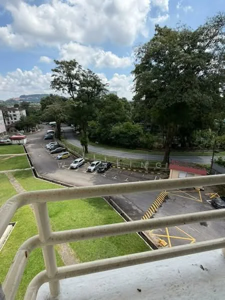 Exterior features: manicured lawn, mature trees, paved parking lot, surrounding greenery, road access, open sky, residential buildings in background.
